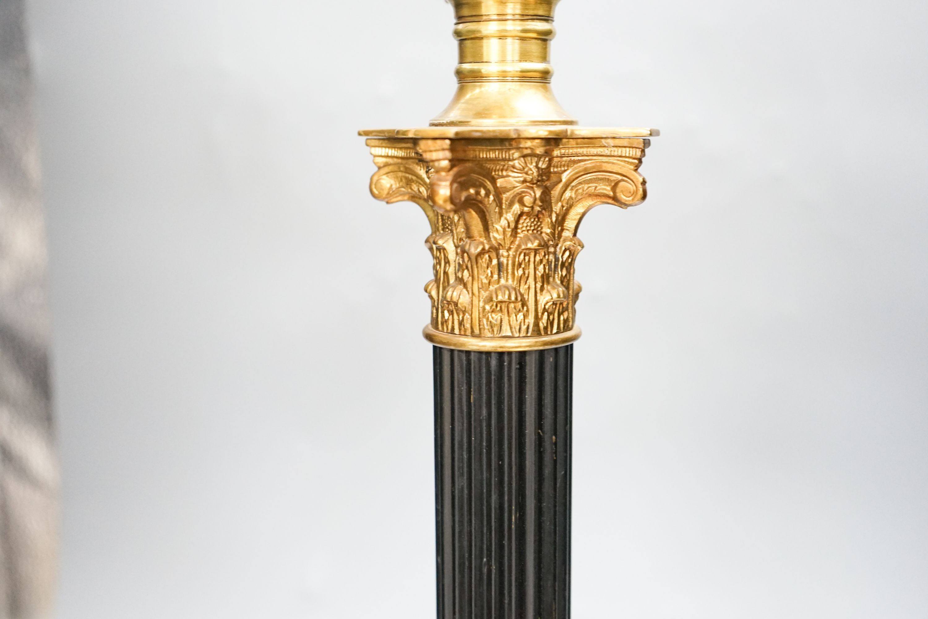 An early 20th century corinthian column oil lamp, converted for electricity, total height 67 cm